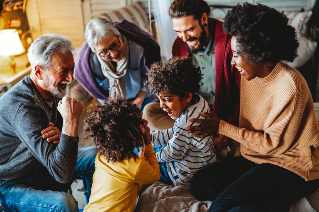 Portrait of happy multi-generation multiethnic family having fun together at home